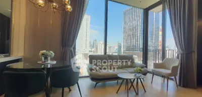 Luxurious living room with stunning city view and elegant furnishings.