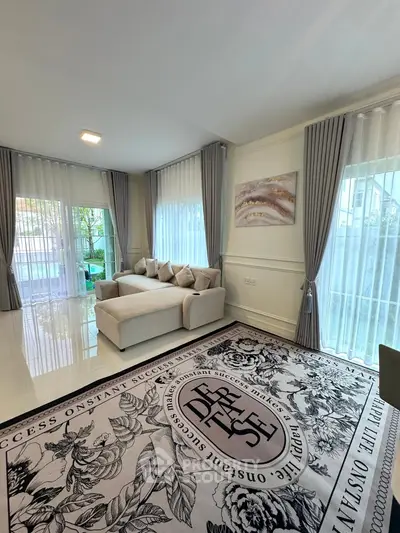 Elegant living room with modern decor and large windows for natural light