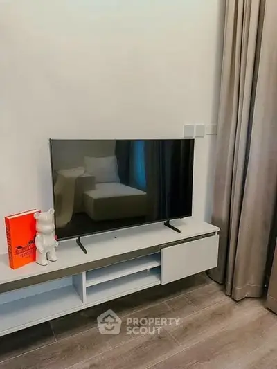 Modern living room with sleek TV setup and stylish decor
