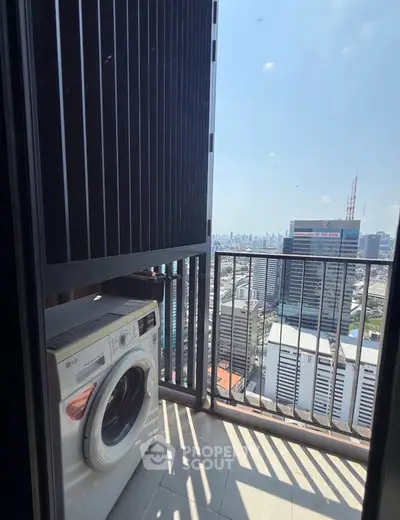 High-rise balcony with washing machine and stunning city view