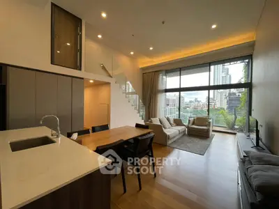 Modern open-plan living room with city view and stylish furnishings