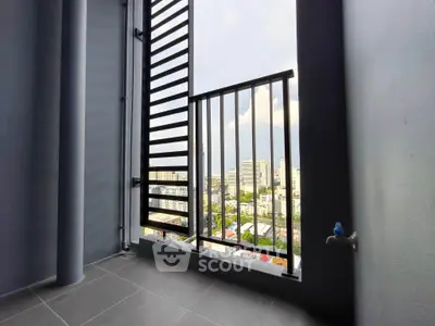 Stunning city view from a modern high-rise balcony with sleek railing design.