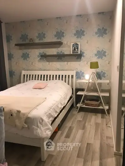 Charming bedroom with floral wallpaper and modern decor