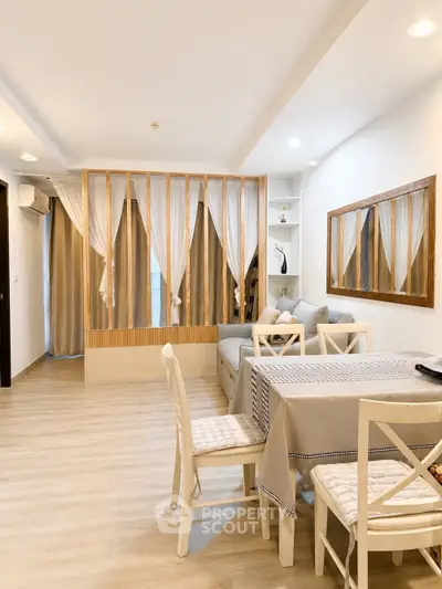 Spacious living room with elegant decor and dining area in modern apartment.