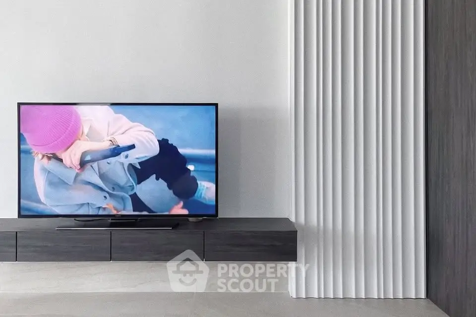 Modern living room with sleek TV unit and minimalist decor