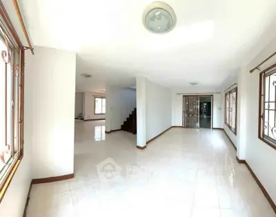 Spacious bright living room with large windows and open layout