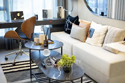 Stylish modern living room with chic decor and cozy seating area, perfect for relaxation and entertaining.