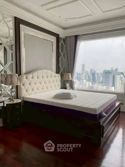 Luxurious bedroom with stunning city view and elegant decor