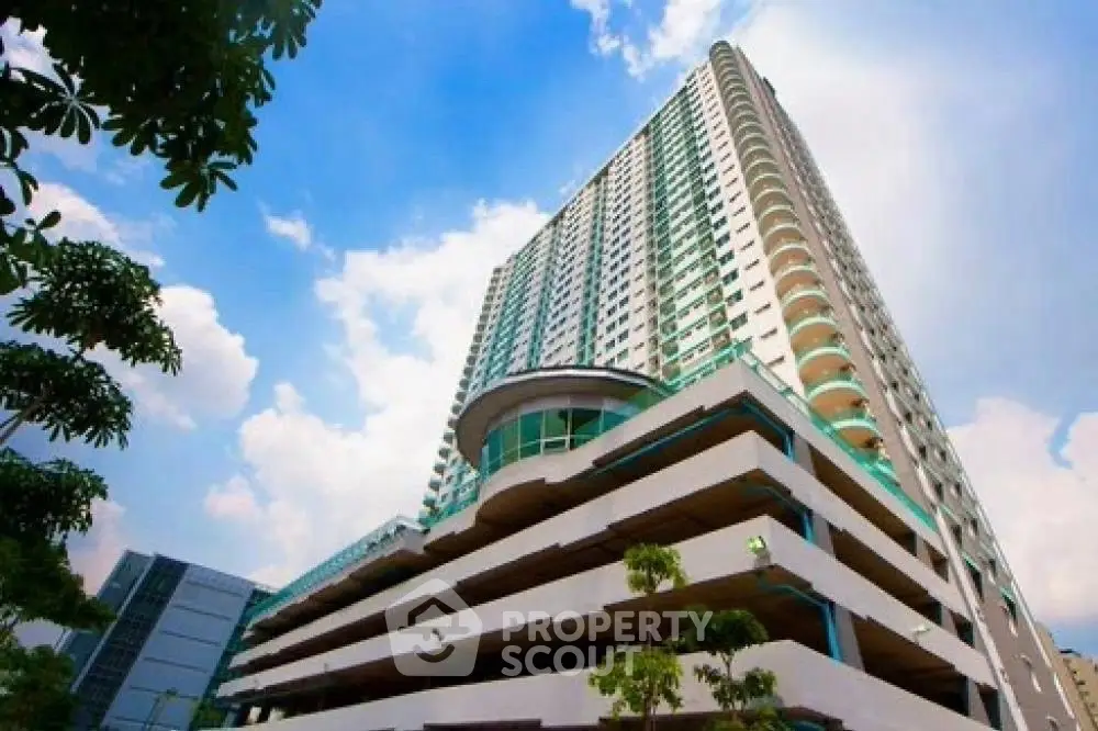 Stunning high-rise building with modern architecture and lush greenery