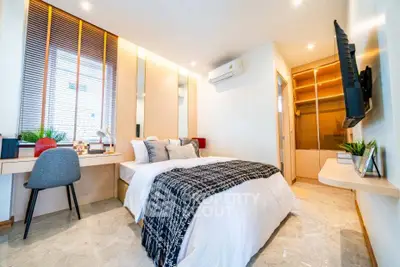 Luxurious modern bedroom with stylish decor and ample natural light