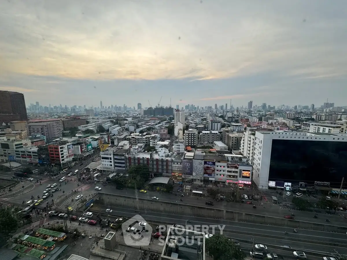 Stunning cityscape view from high-rise building showcasing urban skyline at dusk.