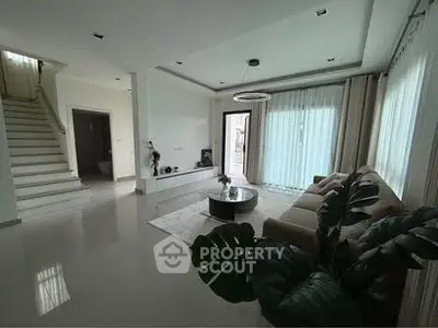 Spacious modern living room with elegant decor and natural light