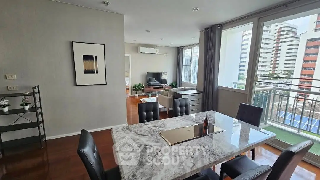 Spacious modern living room with dining area and balcony view in urban apartment