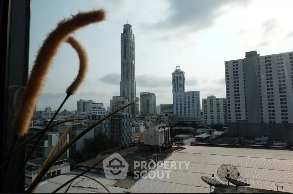 Stunning cityscape view from a high-rise window showcasing modern skyscrapers and urban skyline.