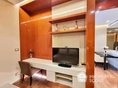 Modern study area with built-in desk and TV in luxurious apartment