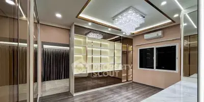 Luxurious modern interior with elegant lighting and mirrored walls, perfect for sophisticated living.