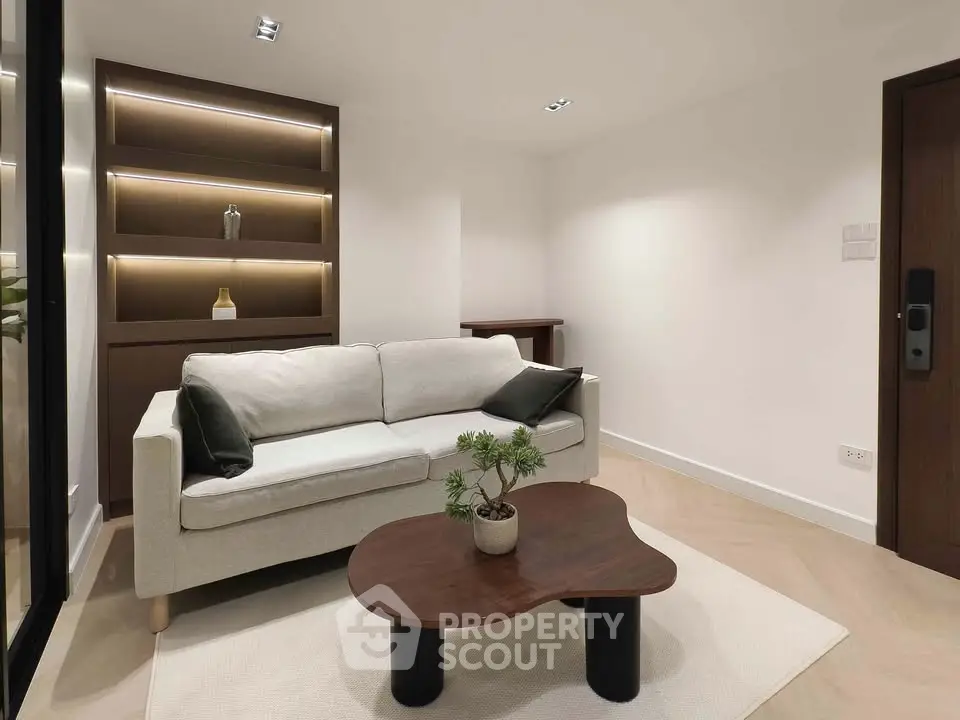 Modern living room with stylish sofa and unique coffee table in a cozy setting.