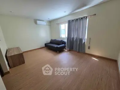 Spacious living room with modern sofa and natural light