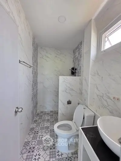 Modern bathroom with elegant marble tiles and stylish fixtures