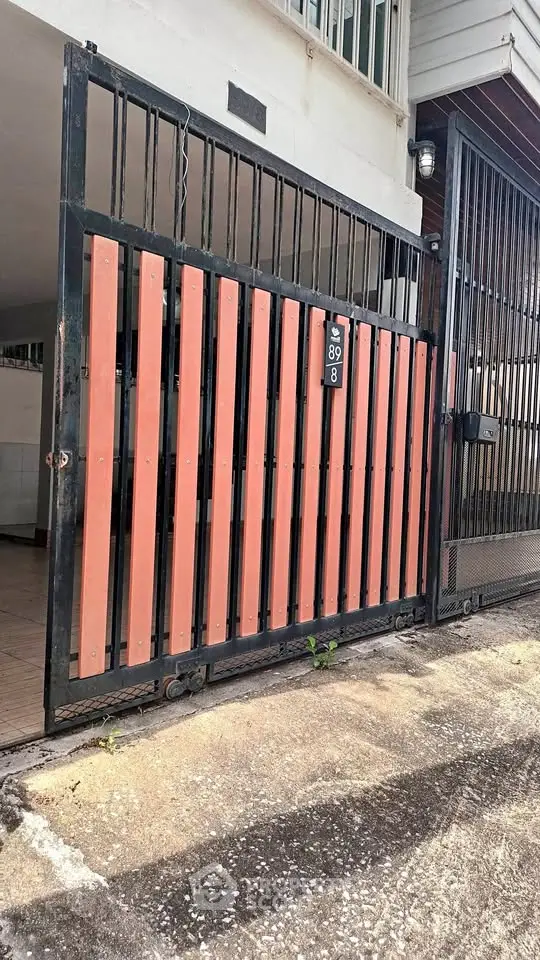 Modern gated entrance with sleek design and secure features for urban living.