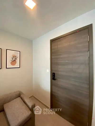 Modern apartment entrance with stylish wooden door and cozy decor