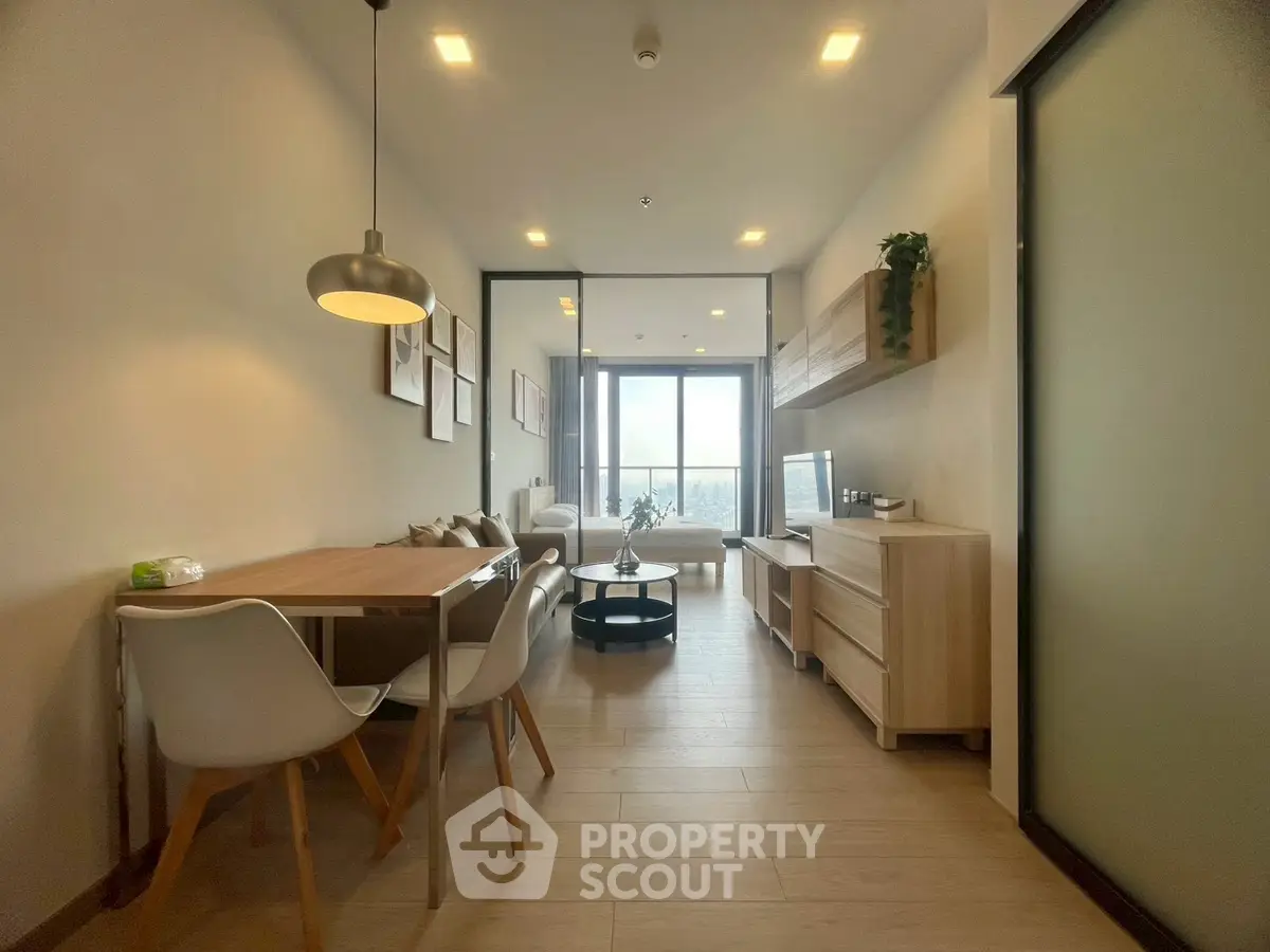 Modern open-plan living and dining area with stylish furniture and natural light