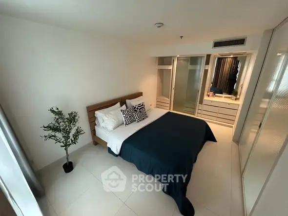 Modern bedroom with sleek design and ample storage space