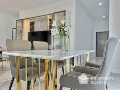 Elegant dining area with modern table and chairs in luxurious apartment