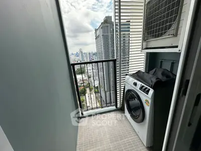 High-rise balcony with city view and washing machine, perfect for urban living.