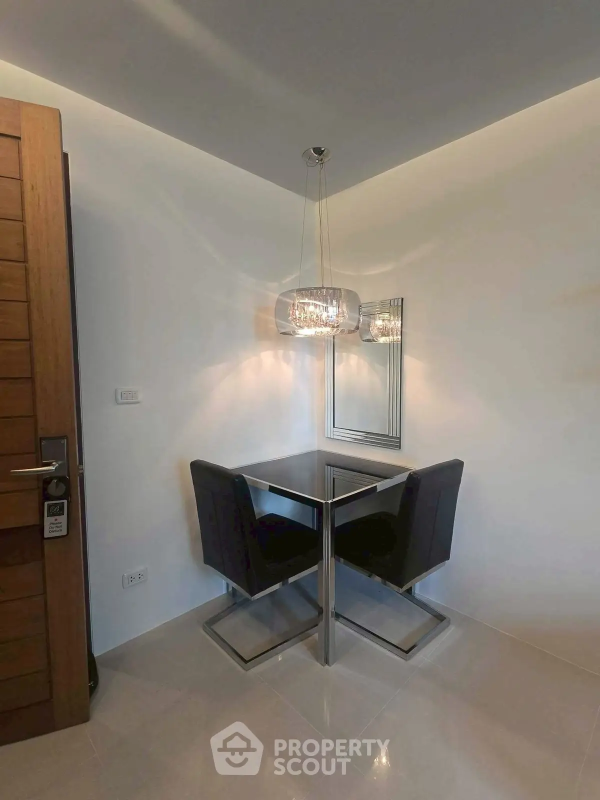 Modern corner dining nook with stylish lighting and mirror