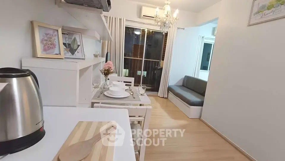 Charming modern living room with dining area and balcony view