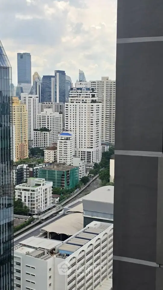 Stunning cityscape view from high-rise building showcasing urban skyline and modern architecture.