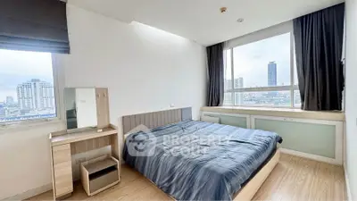 Modern bedroom with city view and stylish furnishings