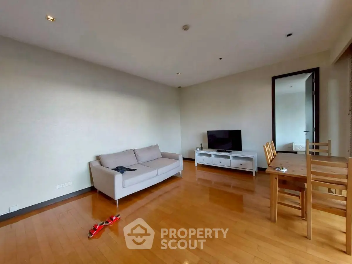 Spacious living room with wooden flooring and modern furniture