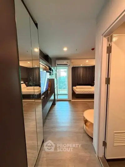 Modern apartment interior with sleek design and cozy bedroom view.