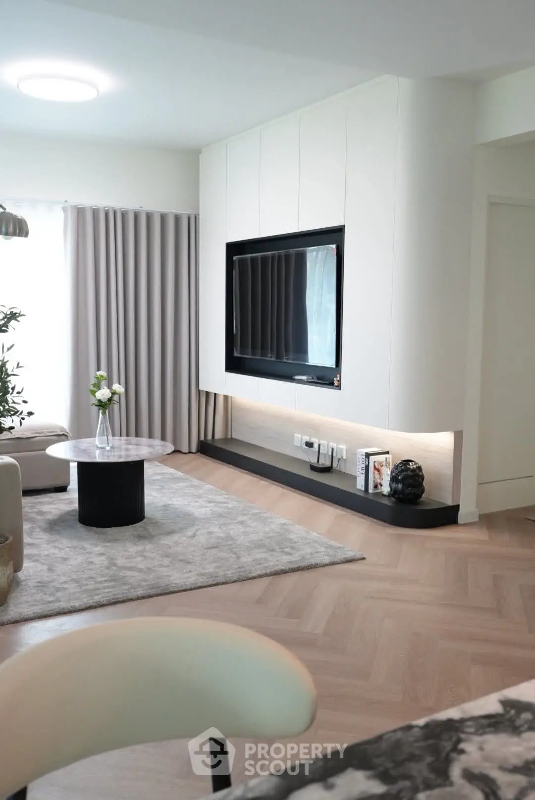 Modern living room with sleek TV setup and elegant decor