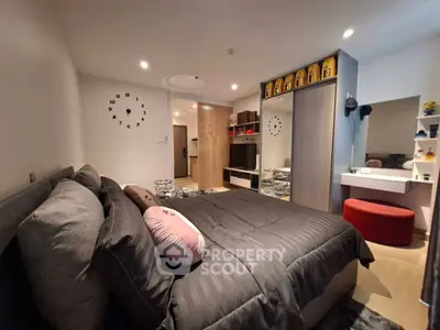 Modern bedroom with stylish decor and cozy ambiance, featuring a comfortable bed and elegant furnishings.