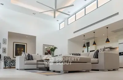 Luxurious modern living room with high ceilings and elegant decor