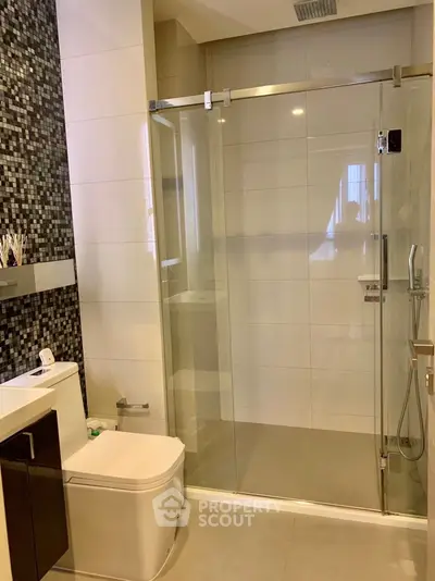 Modern bathroom with glass shower and sleek design