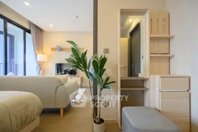 Modern open-plan living room with cozy seating and stylish decor