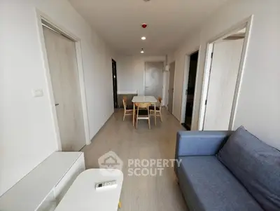 Modern living room with minimalist furniture and neutral tones, perfect for cozy gatherings.