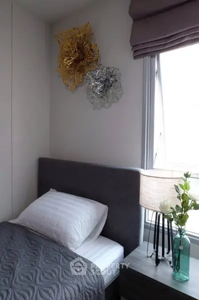 Cozy bedroom with modern decor and natural light