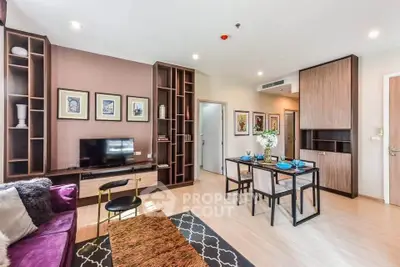 Modern living room with stylish decor and open dining area