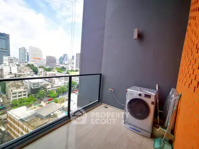 Modern balcony with city view and washing machine, perfect for urban living.