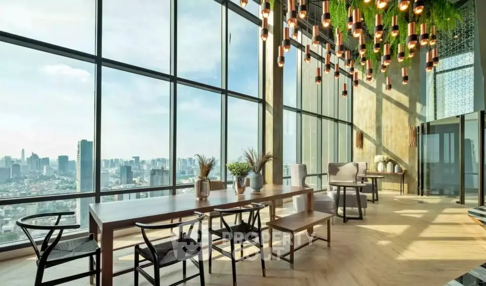 Luxurious high-rise dining area with panoramic city views and modern decor.