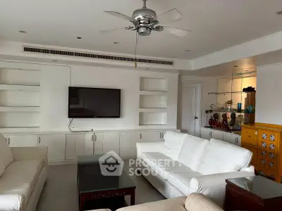 Spacious living room with modern furniture and ceiling fan