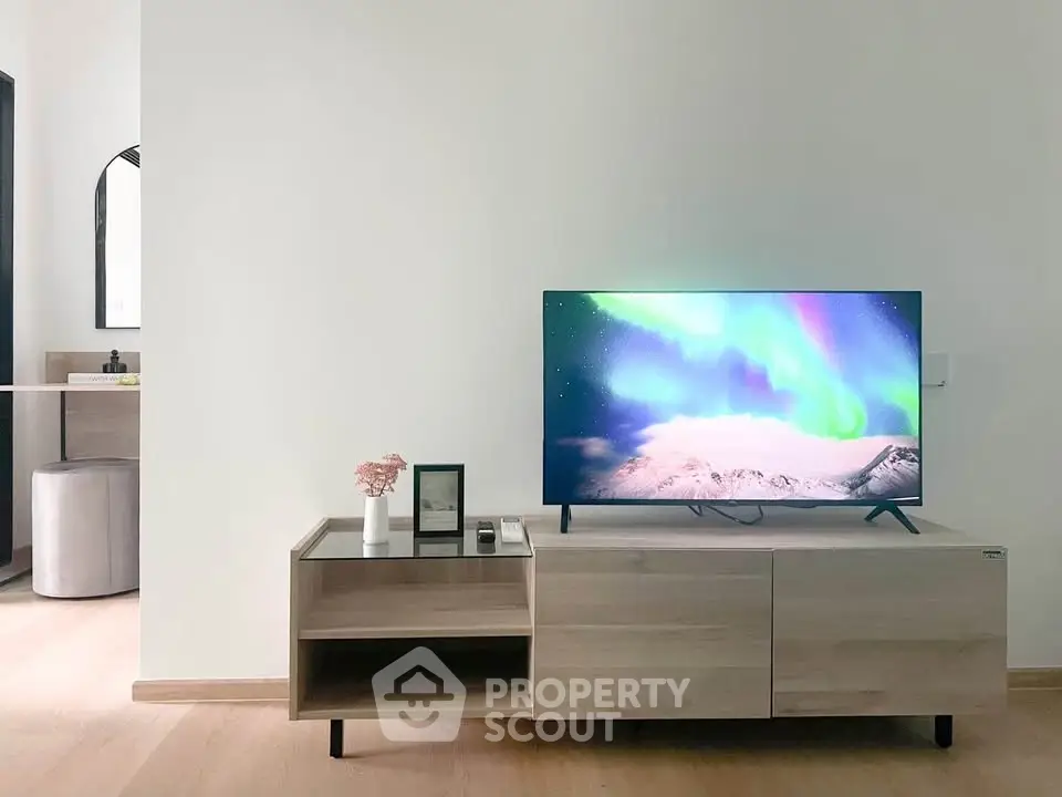 Modern living room with sleek TV stand and vibrant screen display