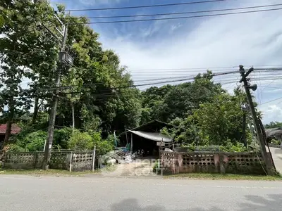 Charming rural property with lush greenery and rustic appeal, perfect for nature lovers seeking tranquility.