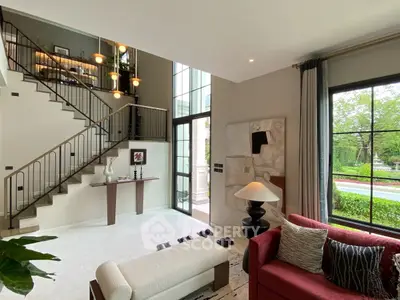 Luxurious modern living room with high ceilings and elegant staircase