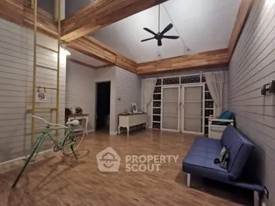 Spacious living room with high ceiling and modern decor